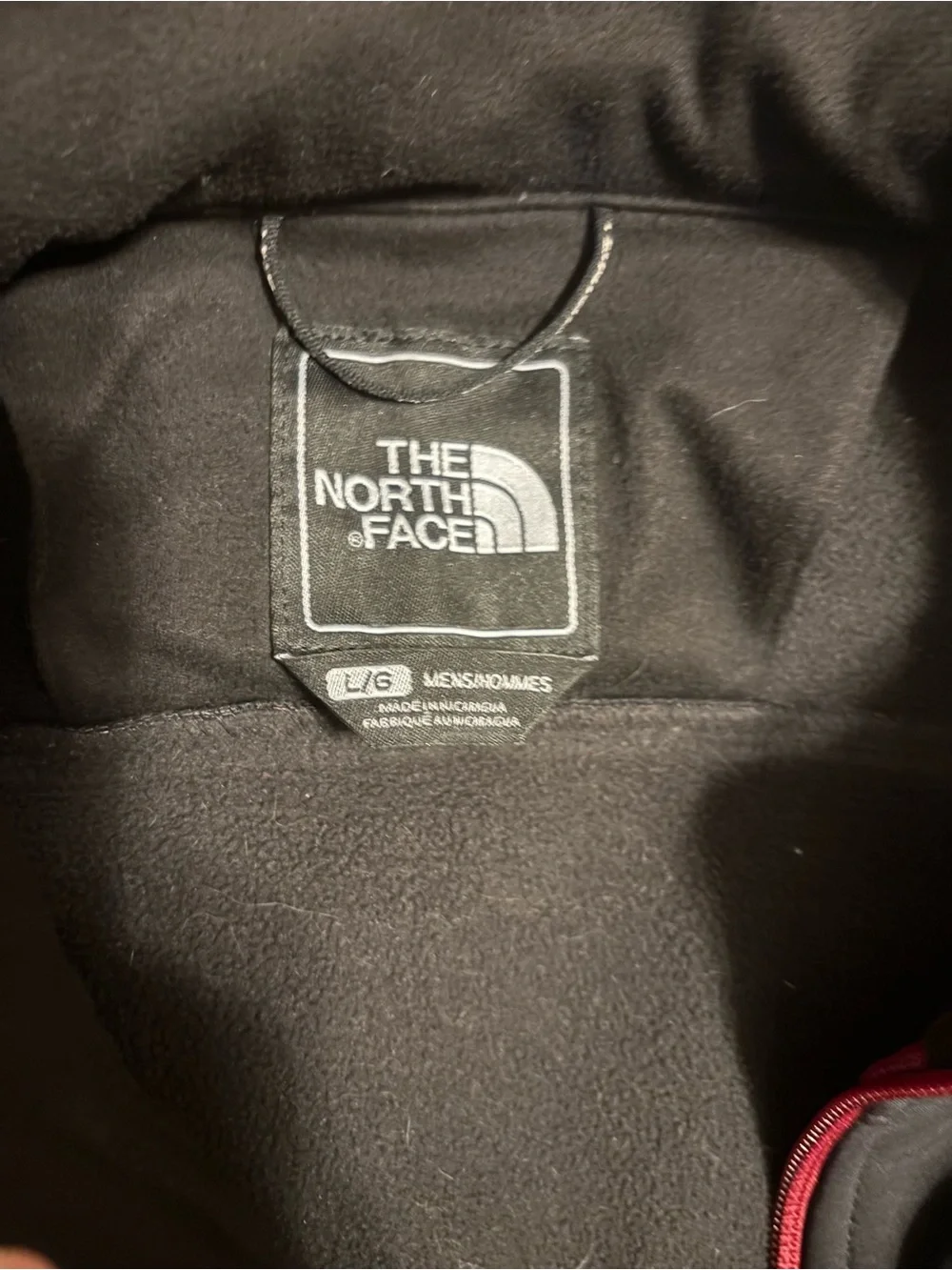 The North Face Men's Black Jacket with Red Accents